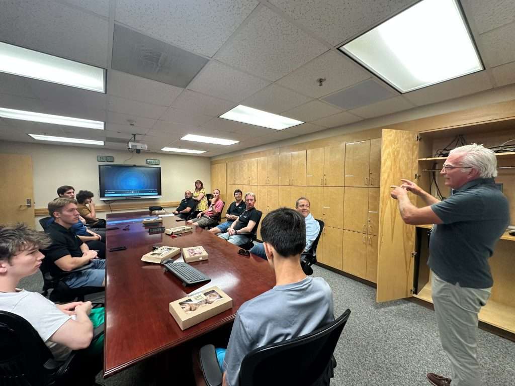 The group receives some explanation from one of the head controllers at KALB (right)