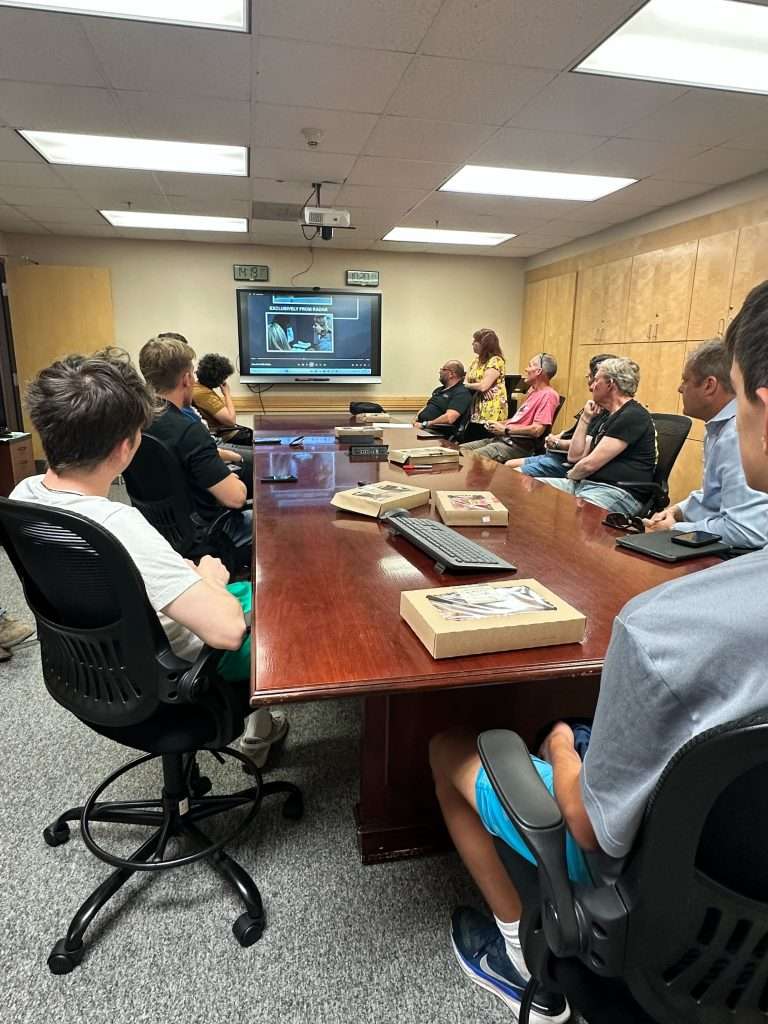 The group is shown an informative presentation about the inner workings of Air Traffic Control.